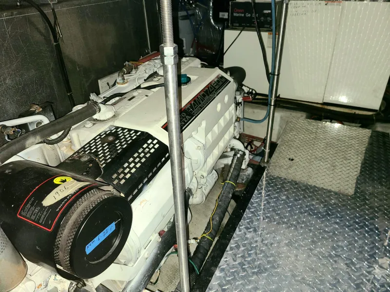 Slide: The Image of Engine room of a 2001 Carver 506 Motor Yacht with visible machinery and equipment. - 42