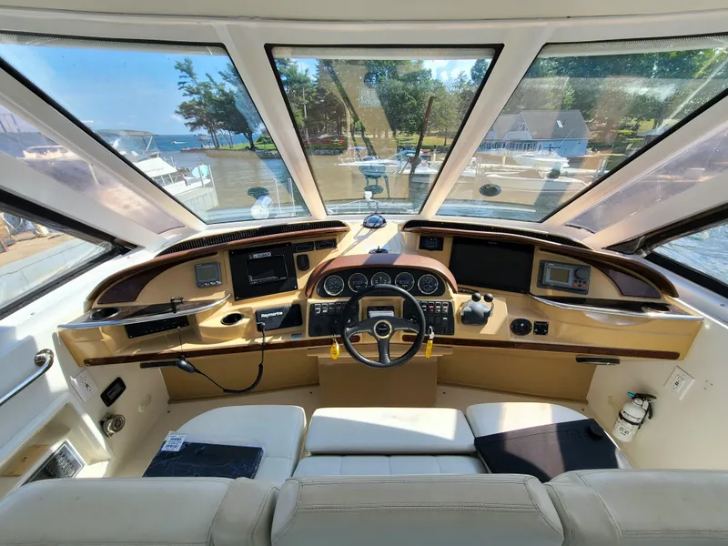 Slide: The Image of Helm of 2001 Carver 506 Motor Yacht with panoramic windows and modern controls. - 11