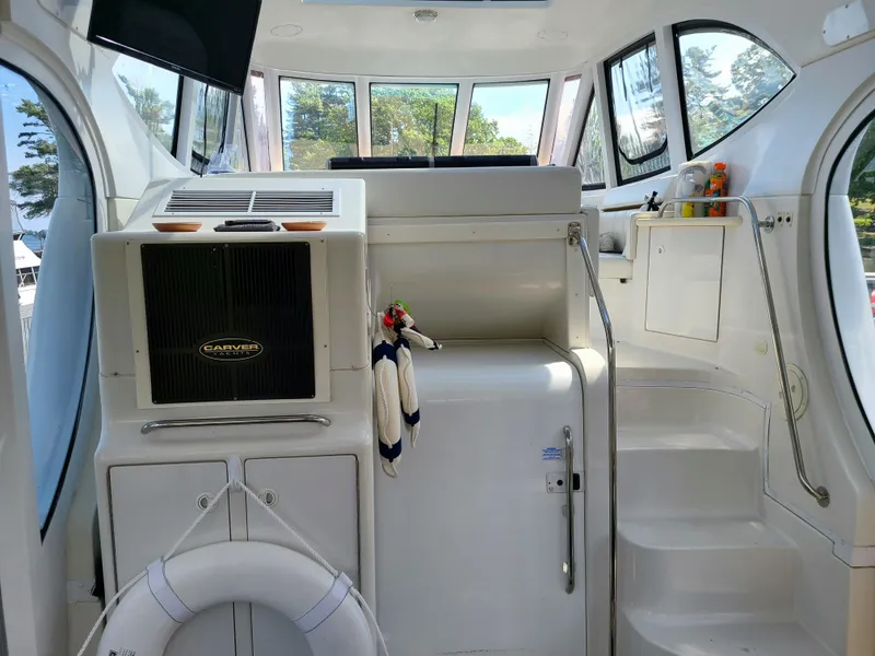 Slide: The Image of Interior of 2001 Carver 506 Motor Yacht with white cabinetry and steps. - 12