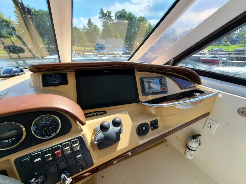 Slide: The Image of Helm of 2001 Carver 506 Motor Yacht with navigation controls and display. - 15