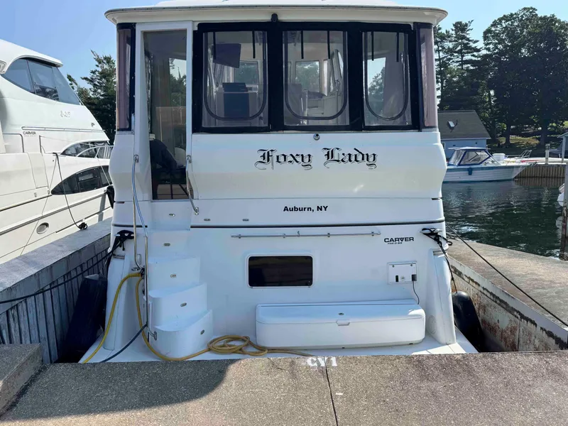 Slide: The Image of 2001 Carver 506 Motor Yacht docked, named "Foxy Lady," in Auburn, NY marina. - 2