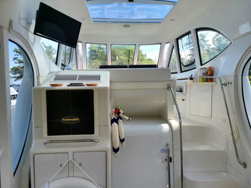 Slide: The Image of Interior of 2001 Carver 506 Motor Yacht with modern amenities and panoramic windows. - 20