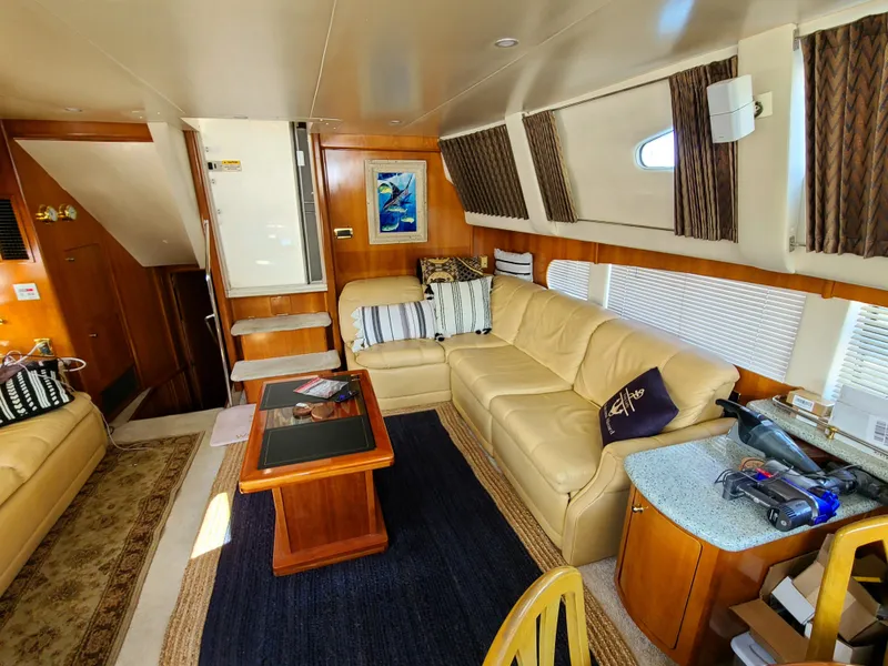 Slide: The Image of Luxurious interior of a 2001 Carver 506 Motor Yacht with beige leather seating. - 22