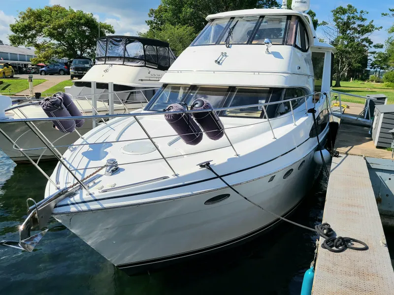 Slide: The Image of 2001 Carver 506 Motor Yacht docked at a marina, sunny day. - 5