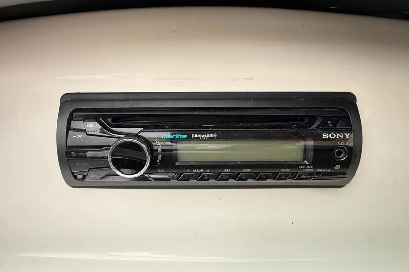 Slide: The Image of Sony marine stereo system in a 2014 Sea Ray 205 Sport boat dashboard. - 12