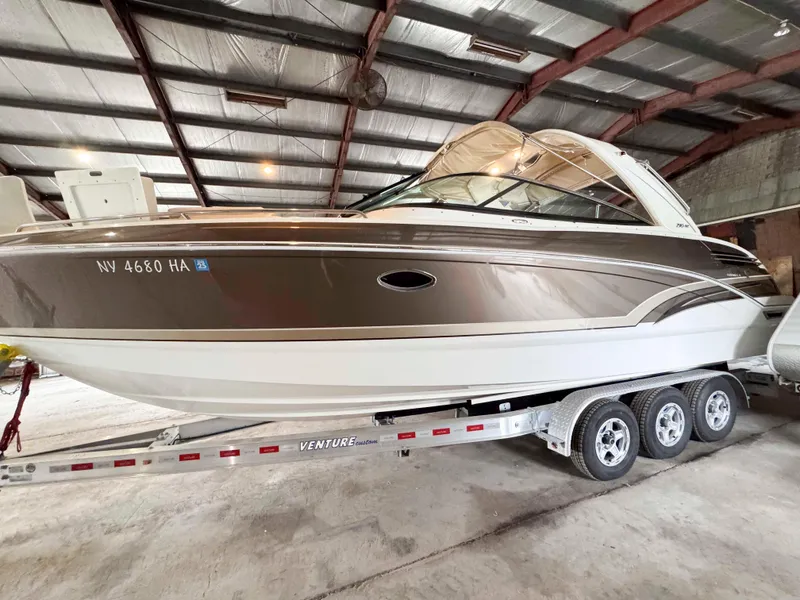 The Image of 2016 Formula 290 Bowrider boat on trailer in indoor storage facility. - 0