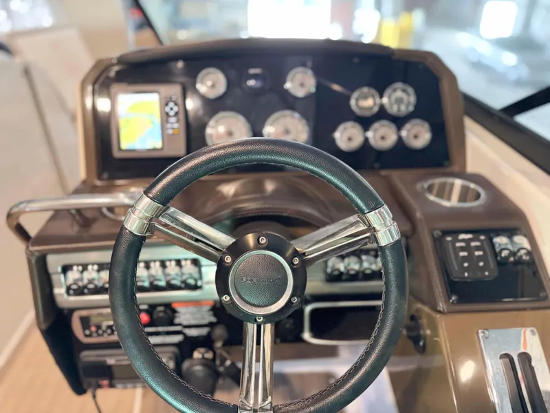 Slide: The Image of Steering wheel and dashboard of 2016 Formula 290 Bowrider boat. - 12