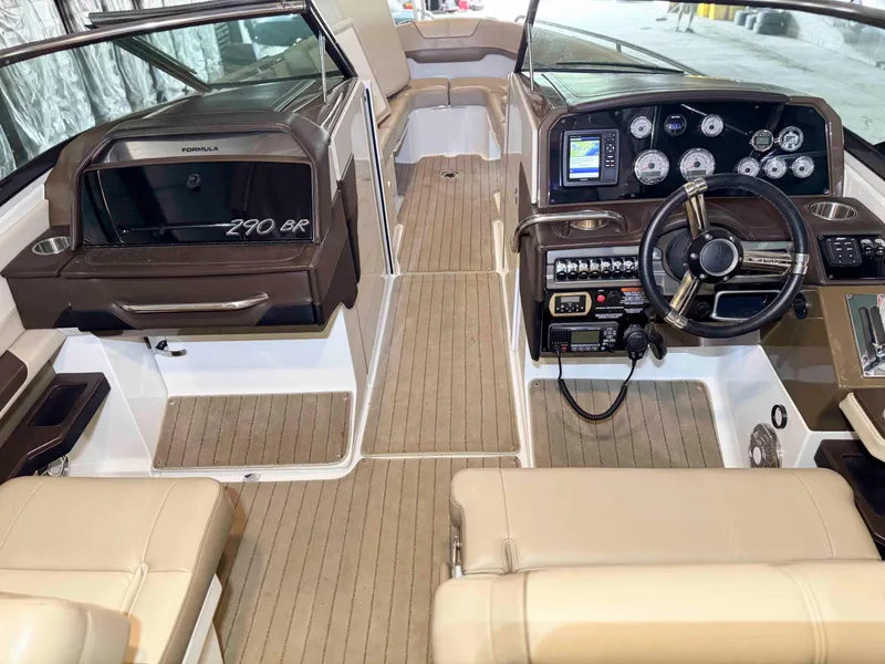 Slide: The Image of 2016 Formula 290 Bowrider interior with dashboard, steering wheel, and seating. - 13