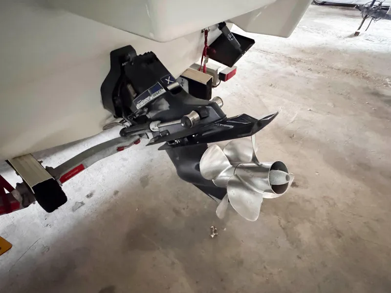 Slide: The Image of 2016 Formula 290 Bowrider boat propeller and stern drive detail in a garage. - 23
