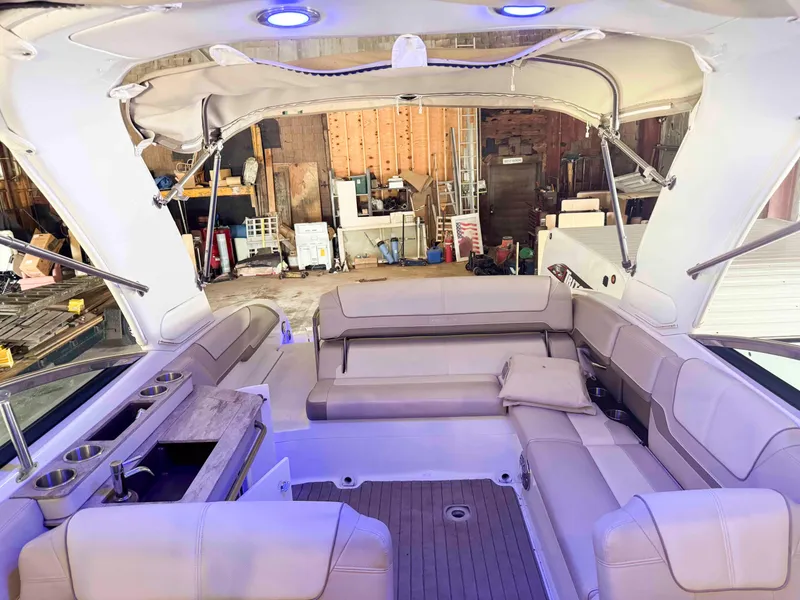 Slide: The Image of 2016 Formula 290 Bowrider interior with spacious seating and modern amenities in a garage setting. - 5