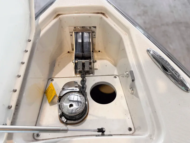 Slide: The Image of Anchor compartment of 2016 Formula 290 Bowrider boat, featuring chain and winch system. - 8