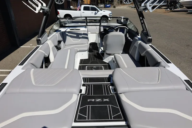 Slide: The Image of 2021 Tigé 22RZX boat interior with sleek gray seating and modern design. - 17