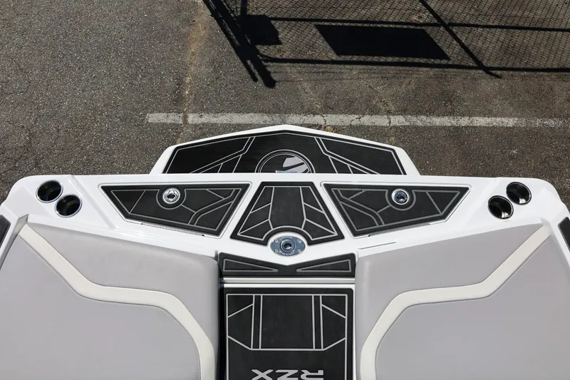 Slide: The Image of 2021 Tigé 22RZX boat deck with sleek black and white design. - 18