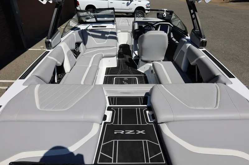 Slide: The Image of 2021 Tigé 22RZX boat interior with sleek gray seating and modern design. - 19