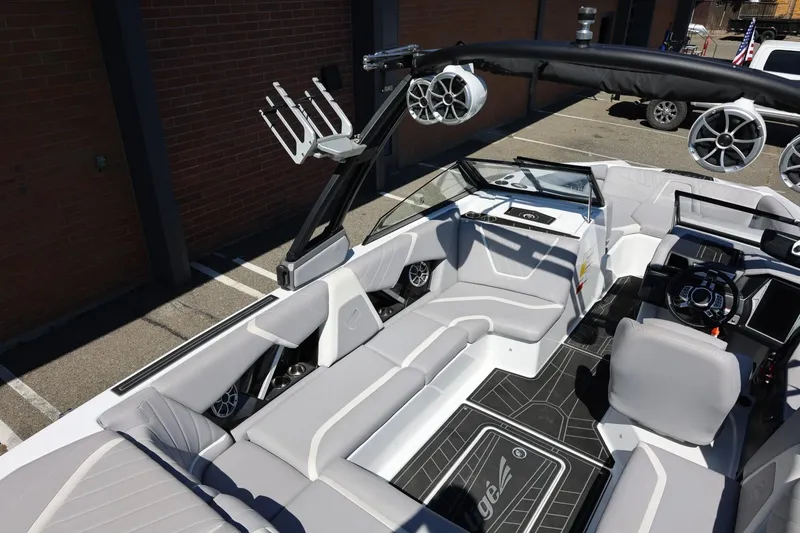 Slide: The Image of 2021 Tigé 22RZX boat interior with sleek seating and advanced audio system. - 22
