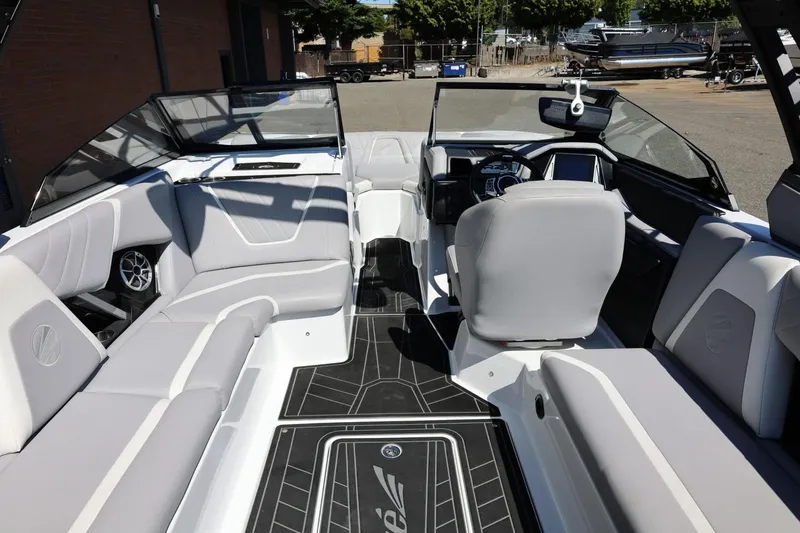 Slide: The Image of 2021 Tigé 22RZX boat interior with sleek seating and modern dashboard design. - 23