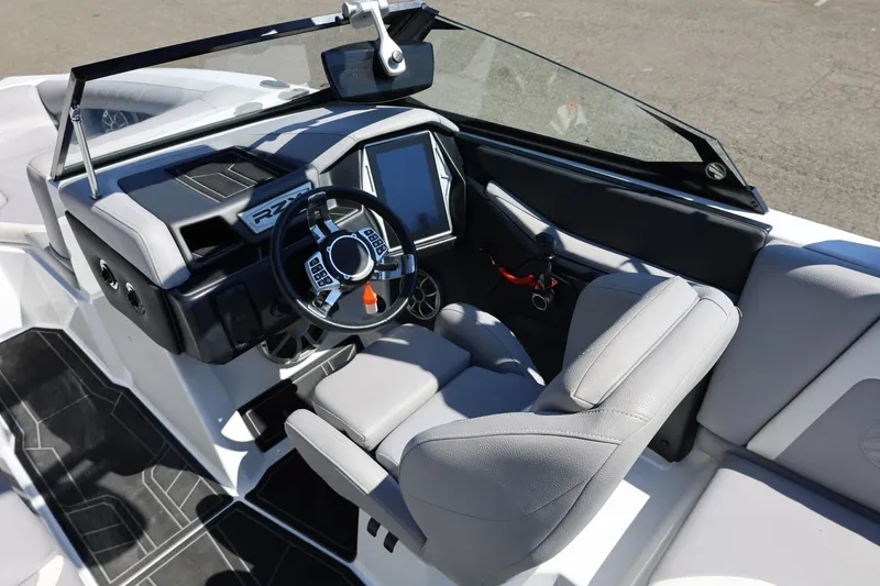 Slide: The Image of 2021 Tigé 22RZX boat interior with modern dashboard and steering wheel. - 25