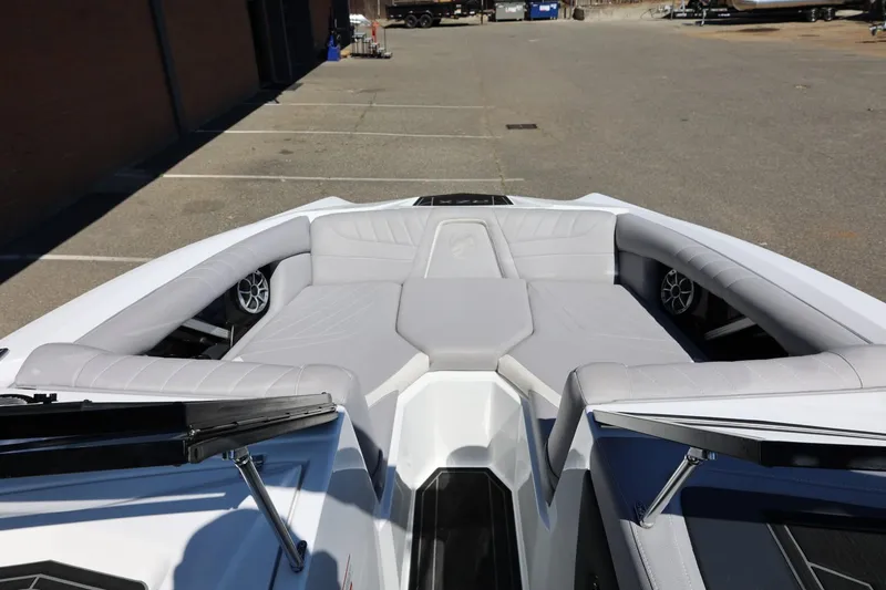 Slide: The Image of 2021 Tigé 22RZX boat interior with gray seating and speakers. - 30