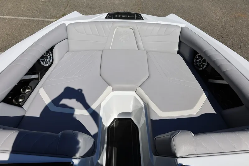 Slide: The Image of 2021 Tigé 22RZX boat interior with gray seating and cup holders. - 31