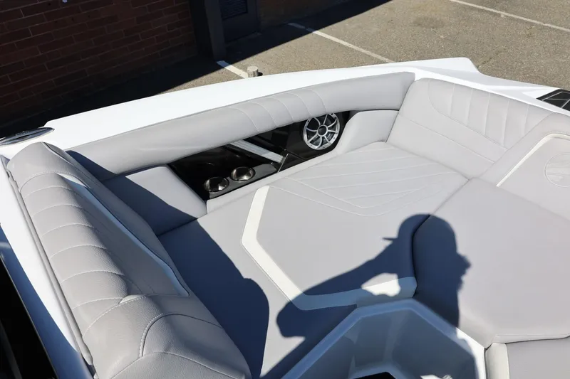 Slide: The Image of 2021 Tigé 22RZX boat interior with gray seating and speaker system. - 32