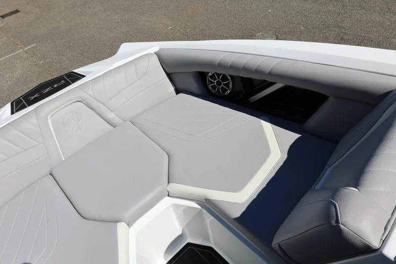 Slide: The Image of 2021 Tigé 22RZX boat interior with gray seating and speaker detail. - 33
