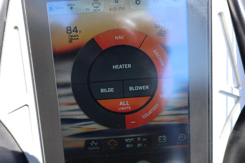 Slide: The Image of Touchscreen control panel of a 2021 Tigé 22RZX boat, displaying temperature and navigation options. - 37