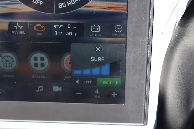 Slide: The Image of Touchscreen display of a 2021 Tigé 22RZX boat showing surf settings and engine data. - 41