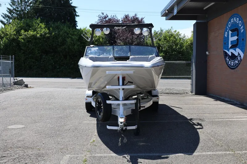 Slide: The Image of 2021 Tigé 22RZX boat on trailer at Bjornson Marine dealership. - 5