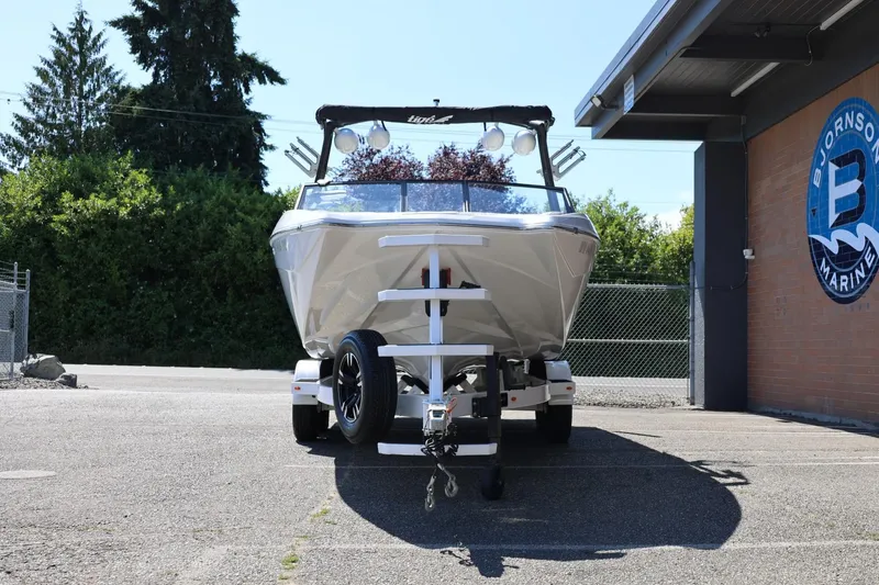 Slide: The Image of 2021 Tigé 22RZX boat on trailer at Bjornson Marine dealership. - 6