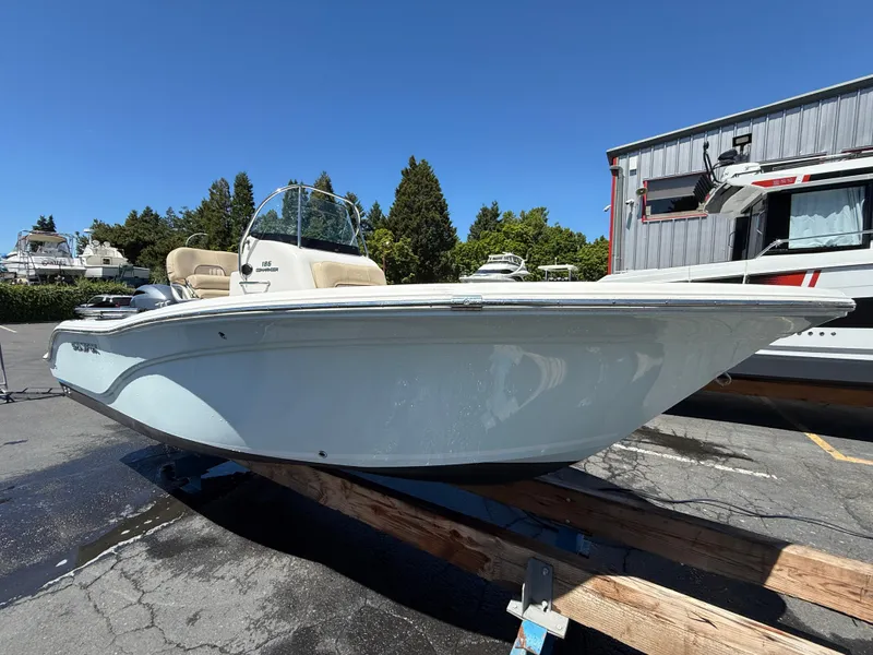 Slide: The Image of 2018 Sea Fox 186 Commander boat on display in a sunny outdoor setting. - 2