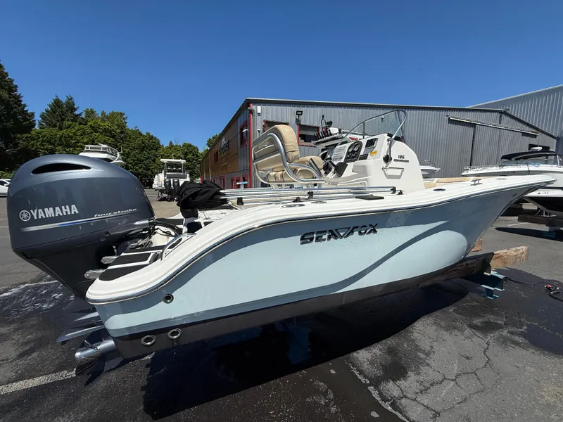 Slide: The Image of 2018 Sea Fox 186 Commander boat with Yamaha engine, parked outdoors. - 6