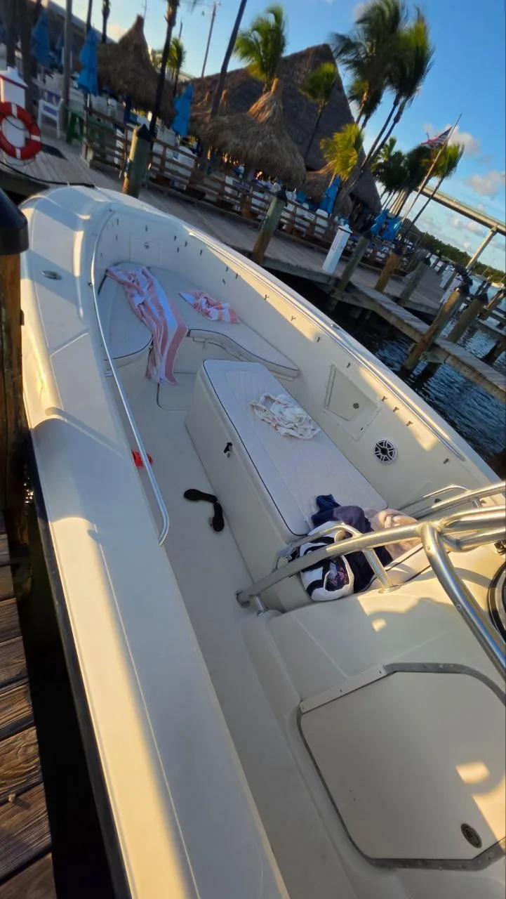 Slide: The Image of 2008 Hydra-Sports Vector 3300 CC boat docked, with tropical setting and palm trees in background. - 3