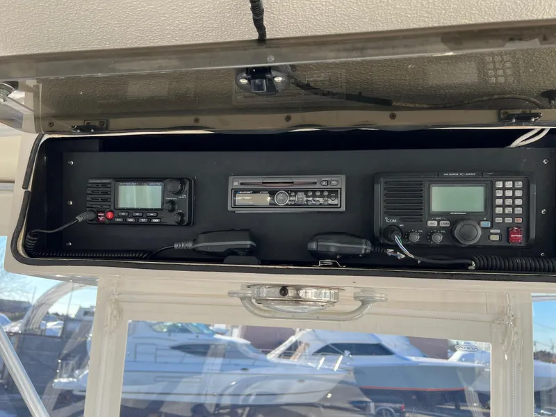 Slide: The Image of 1992 Blackfin 29 Flybridge dashboard with marine radio and audio system. - 18