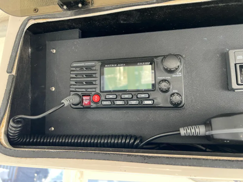 Slide: The Image of Marine radio equipment on a 1992 Blackfin 29 Flybridge boat dashboard. - 19