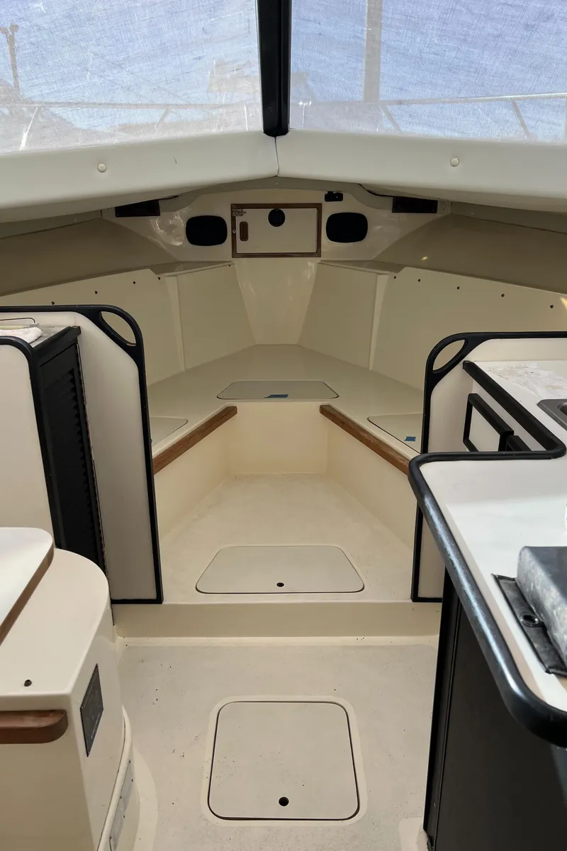 Slide: The Image of Interior of a 1992 Blackfin 29 Flybridge boat, featuring a clean, spacious cabin layout. - 21