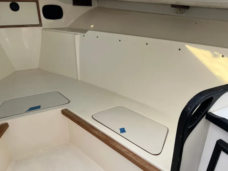 Slide: The Image of Interior of 1992 Blackfin 29 Flybridge boat, featuring storage compartments and seating area. - 23