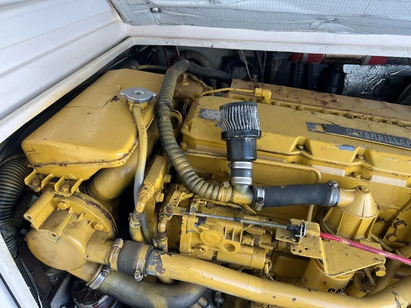 Slide: The Image of Yellow Caterpillar engine in a 1992 Blackfin 29 Flybridge boat. - 33