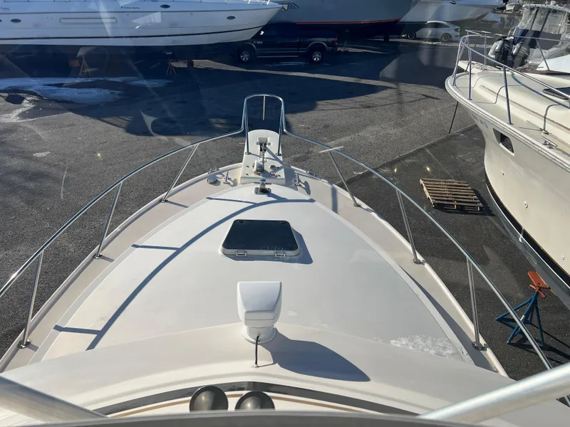 Slide: The Image of 1992 Blackfin 29 Flybridge boat deck view in a marina setting. - 8