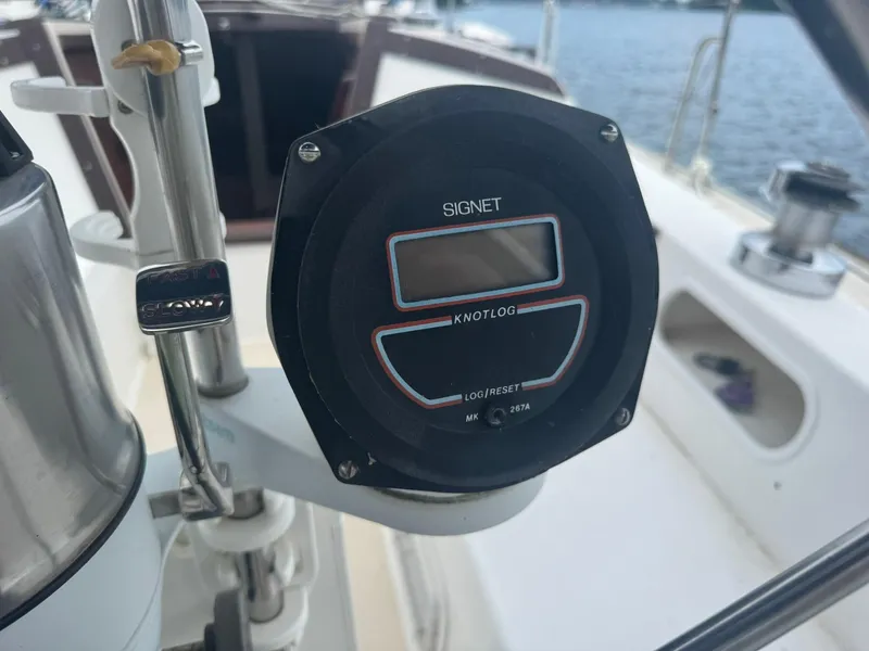 Slide: The Image of Cockpit of 1989 Catalina 34 sailboat featuring a Signet knotlog instrument. - 8