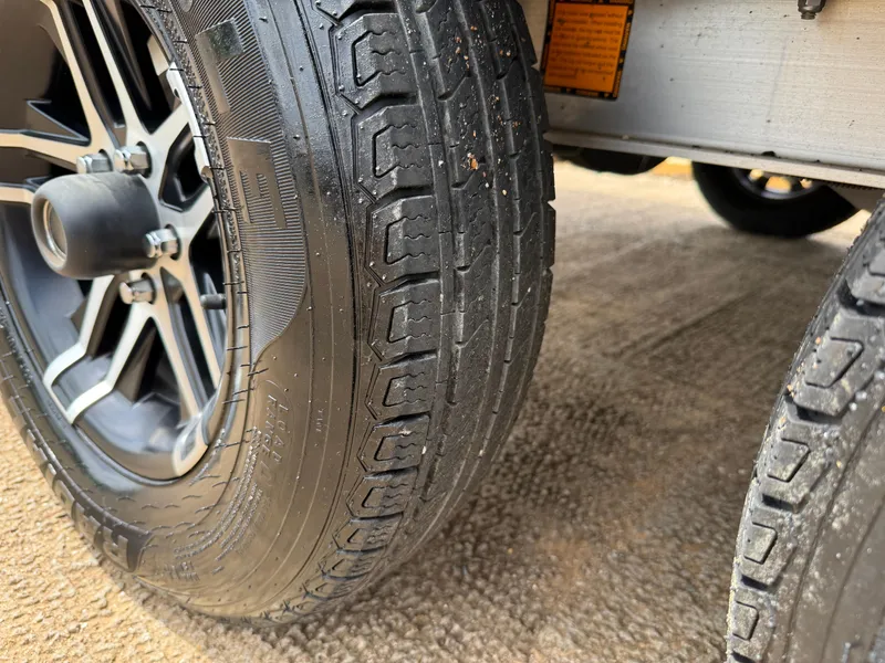 Slide: The Image of Close-up of 2022 Stingray 212 SC trailer tire on a textured surface. - 15