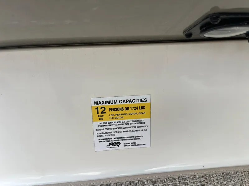 Slide: The Image of 2022 Stingray 212 SC boat capacity label, maximum 12 persons or 1724 lbs. - 92