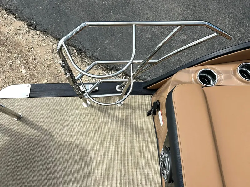 Slide: The Image of 2023 Harris Grand Mariner 230 boat deck with stainless steel railing and cup holders. - 22