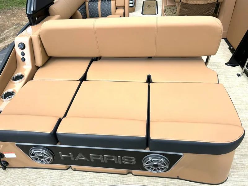 Slide: The Image of 2023 Harris Grand Mariner 230 boat interior with tan seating and cup holders. - 25