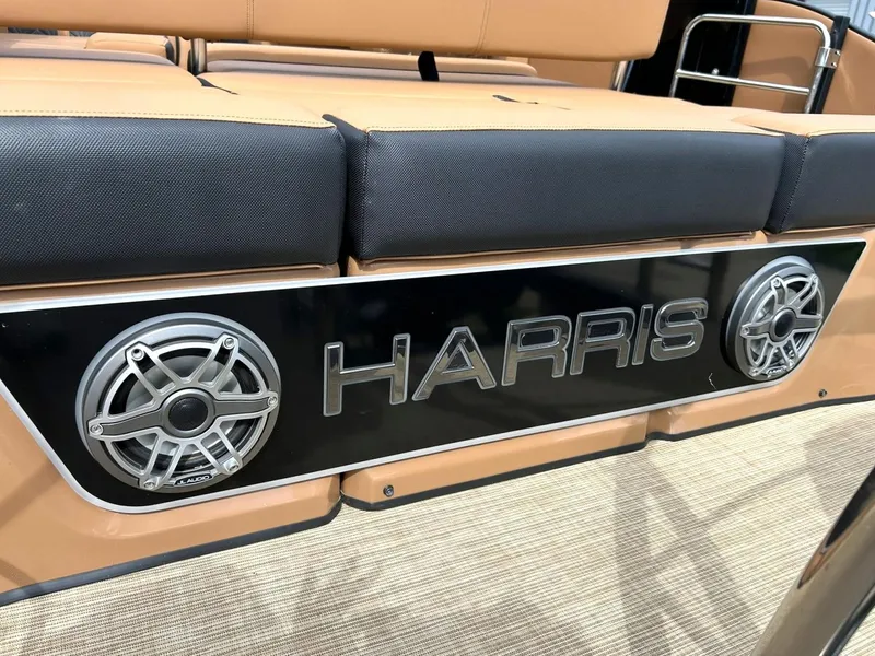 Slide: The Image of 2023 Harris Grand Mariner 230 boat interior with branded speakers and seating. - 26