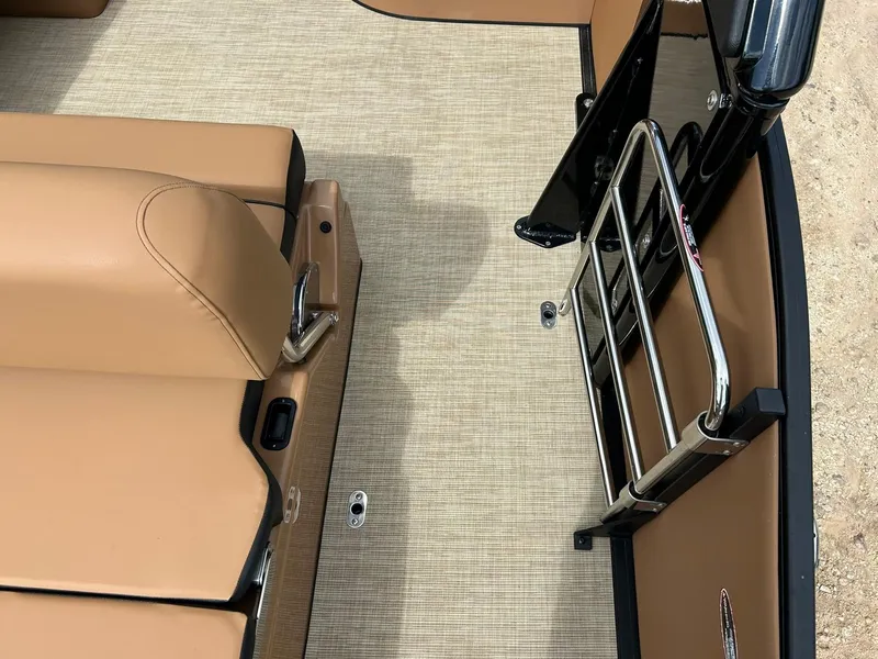 Slide: The Image of 2023 Harris Grand Mariner 230 interior with tan seating and stainless steel ladder. - 29