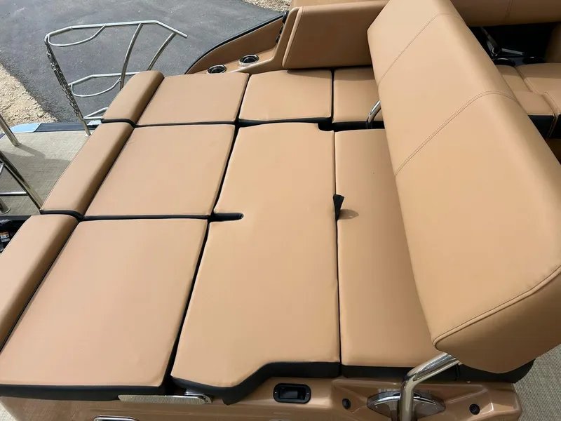 Slide: The Image of 2023 Harris Grand Mariner 230 boat with tan leather seating and stainless steel railings. - 31