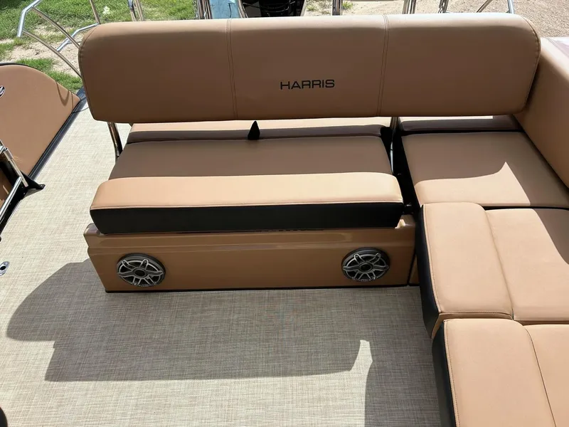 Slide: The Image of 2023 Harris Grand Mariner 230 boat interior with tan seating and built-in speakers. - 33