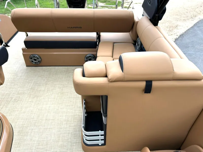Slide: The Image of 2023 Harris Grand Mariner 230 interior with tan leather seating and integrated speakers. - 34