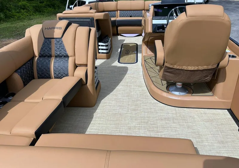 Slide: The Image of 2023 Harris Grand Mariner 230 interior with luxurious tan seating and modern helm design. - 35