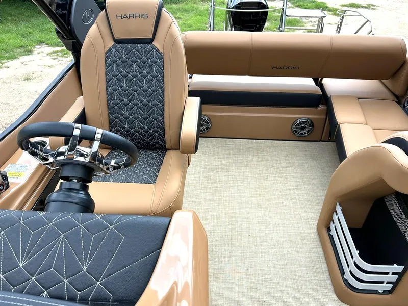 Slide: The Image of Luxurious interior of 2023 Harris Grand Mariner 230 boat with elegant seating and steering wheel. - 38